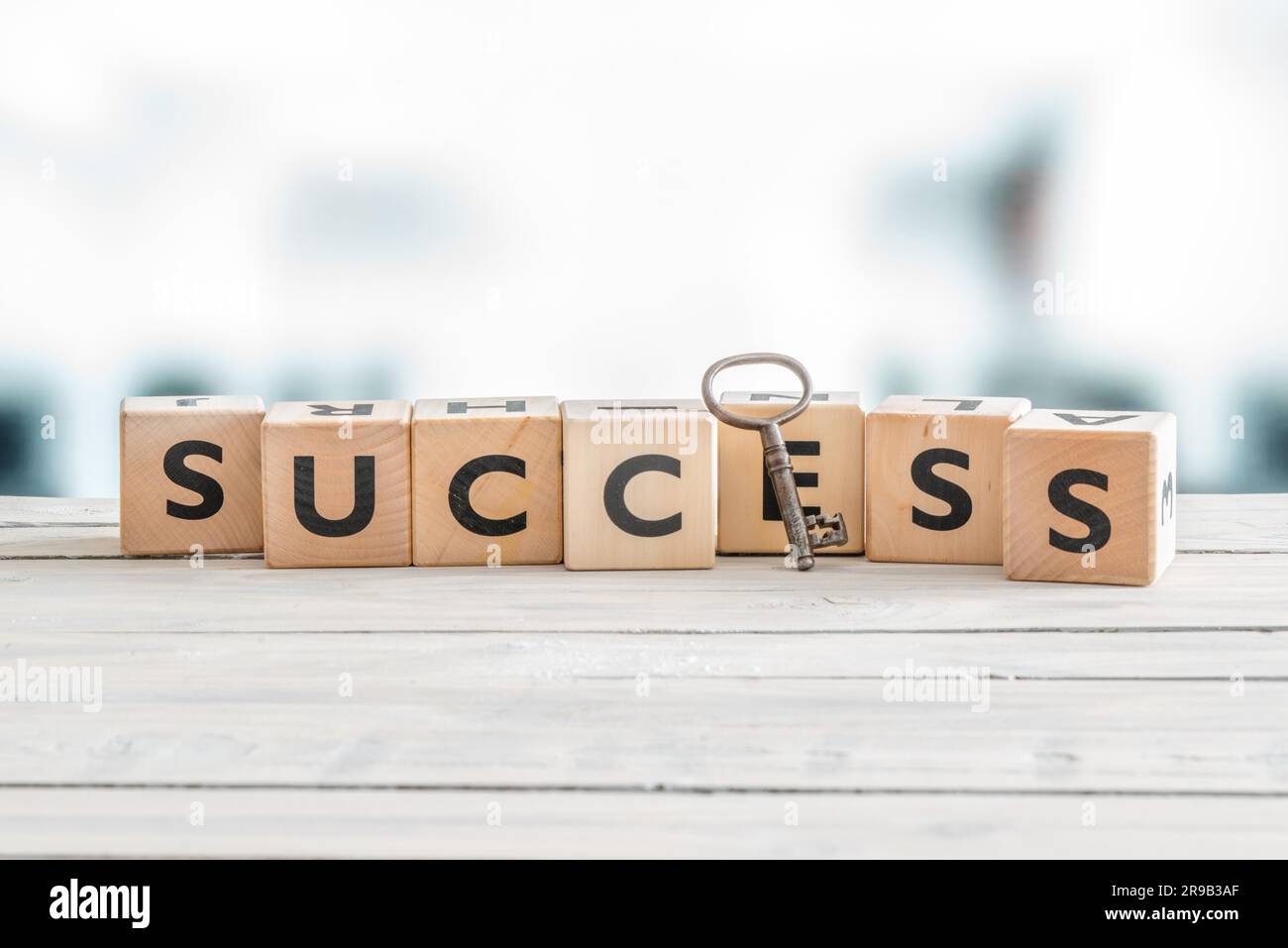 The word success with a metal key Stock Photo