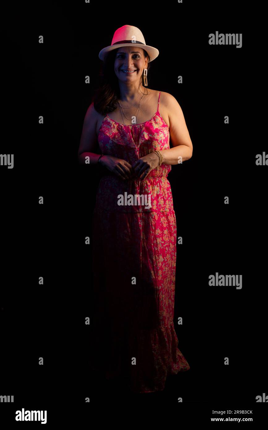 Full Length Portrait Of Beautiful Mature Woman Wearing Hat Looking full-length-portrait-of-beautiful-mature-woman-wearing-hat-looking
