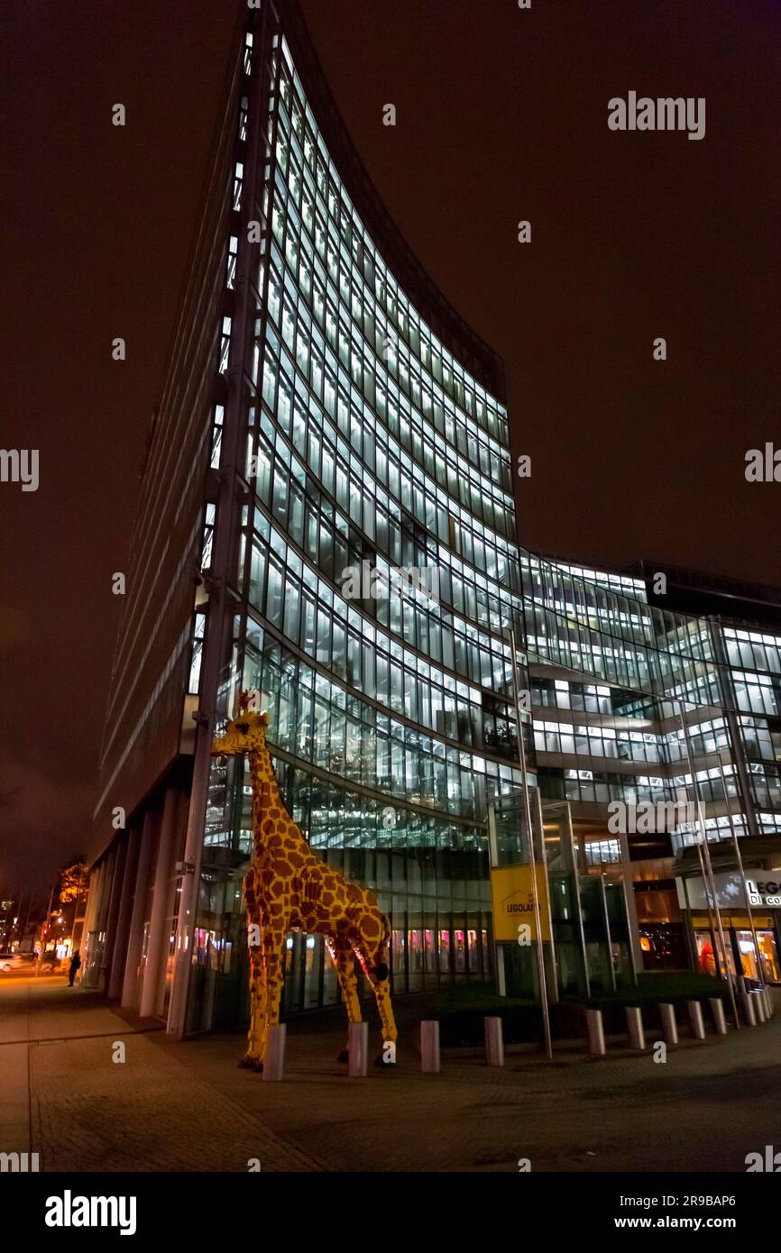 Berlin, Germany - 17 DEC 2021: Huge plastic giraffe statue in front of