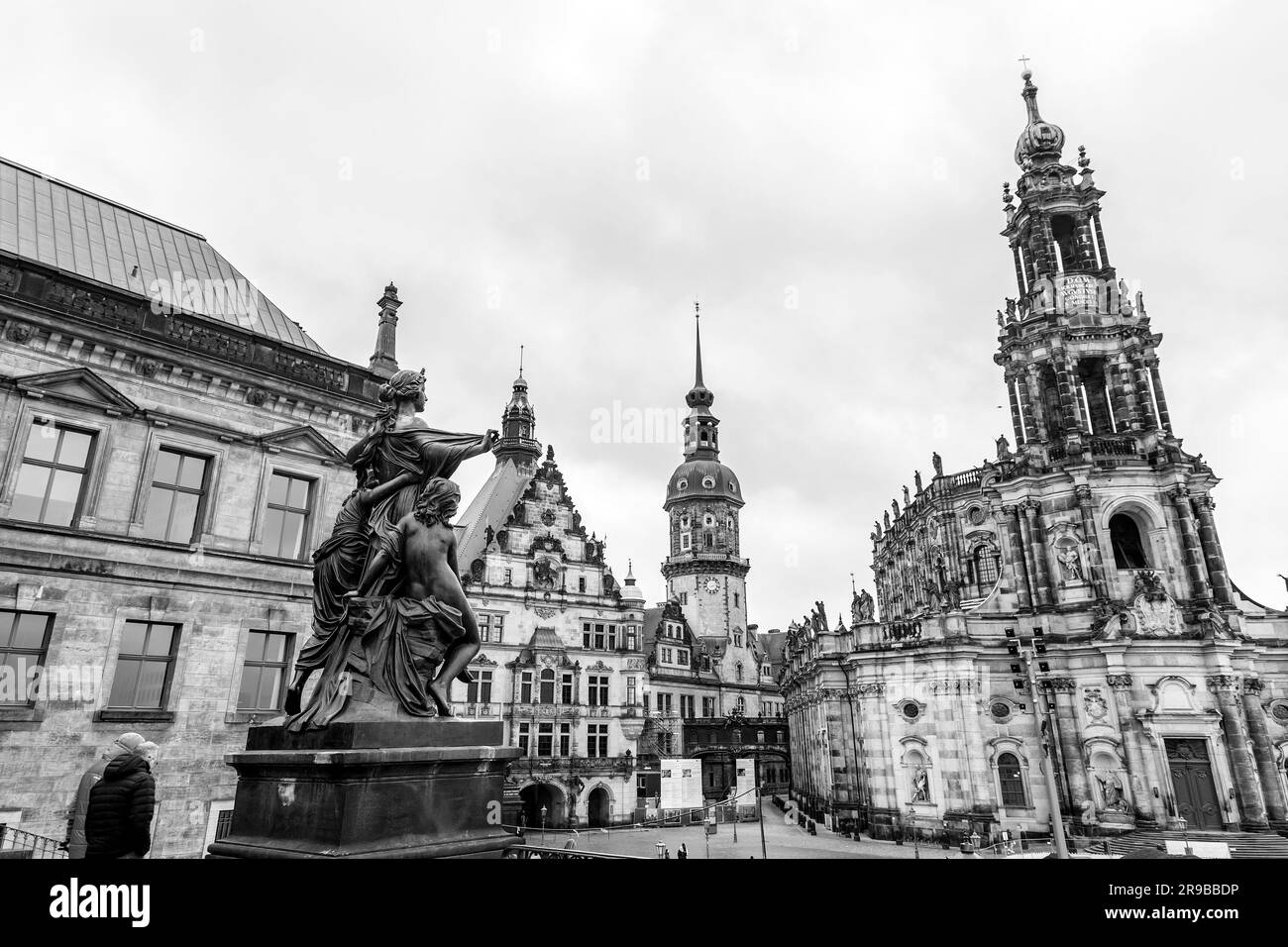 Backside of a statue facing towards the Cathedral of the Holy Trinity, Katolische Hofkirche in the old town of Dresden, Germany. Stock Photo