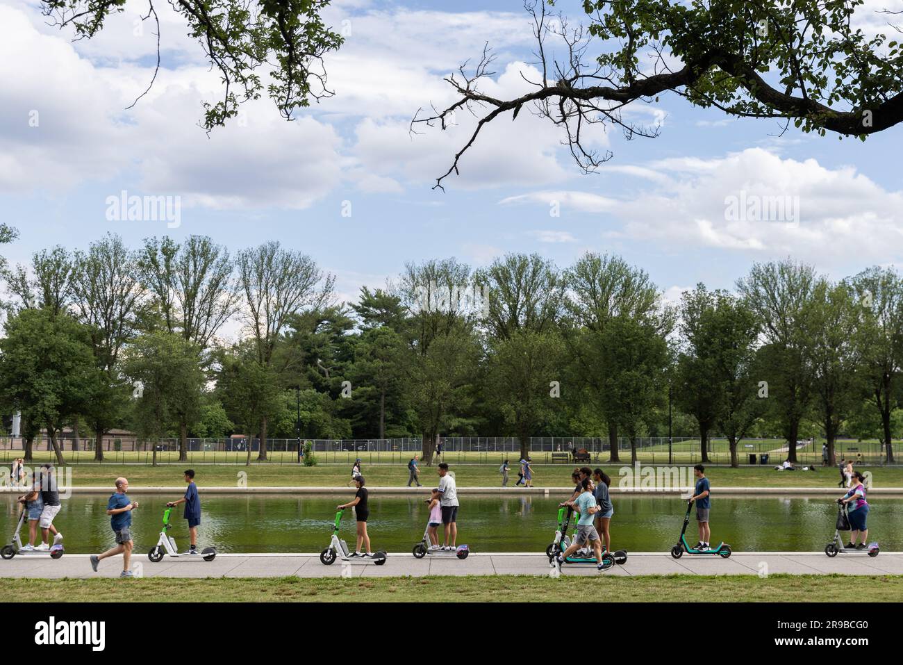 Washington, USA. 25th June, 2023. People ride scooters on the National