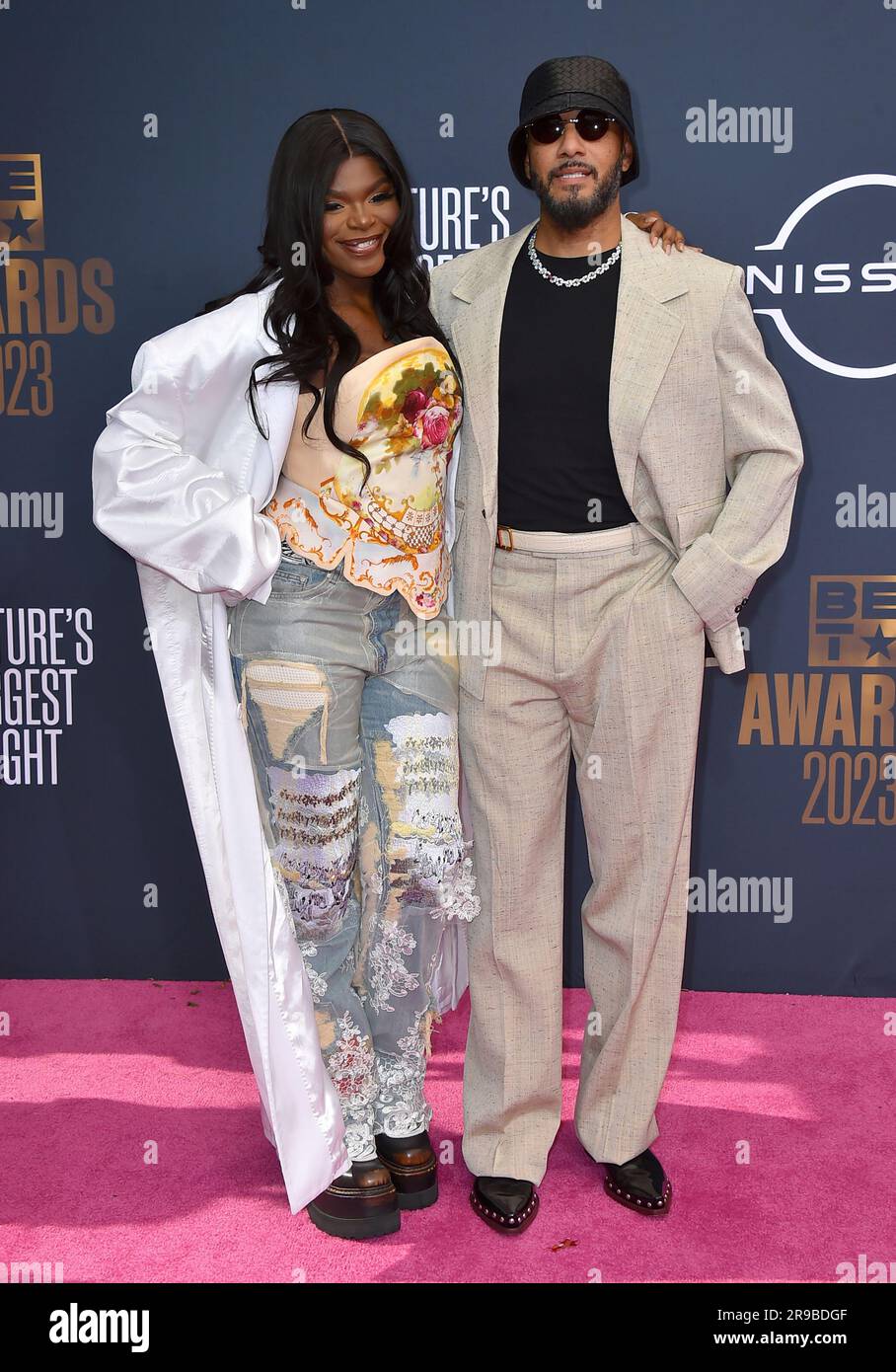 Scar Lip, left, and Swizz Beatz arrive at the BET Awards on Sunday