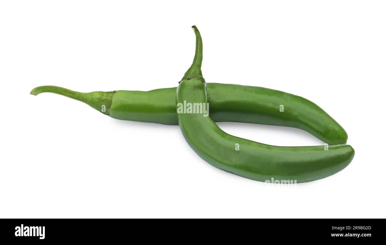 Green hot chili peppers on white background Stock Photo - Alamy