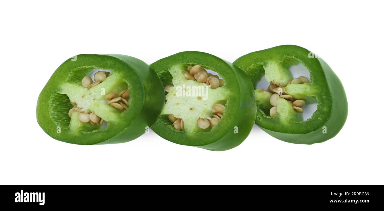 Cut green hot chili pepper isolated on white, top view Stock Photo - Alamy