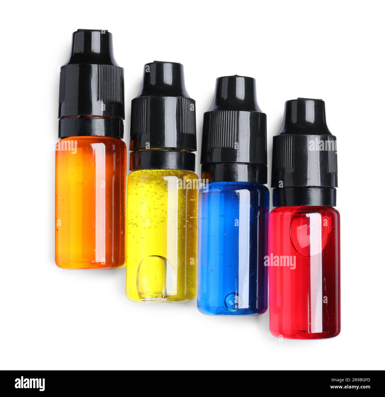 Bottles with different food coloring on white background, top view Stock Photo