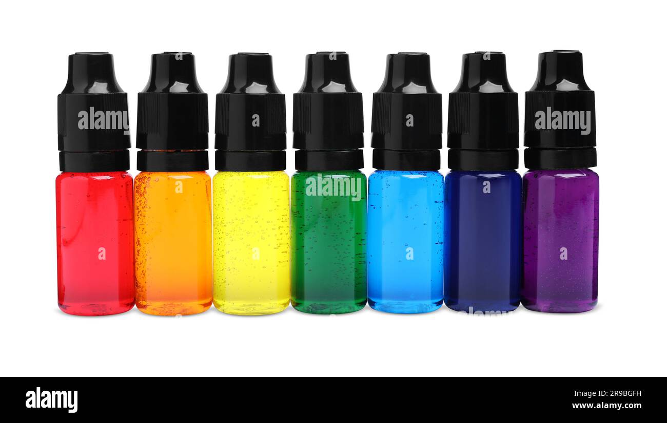 Bottles with different food coloring on white background Stock Photo