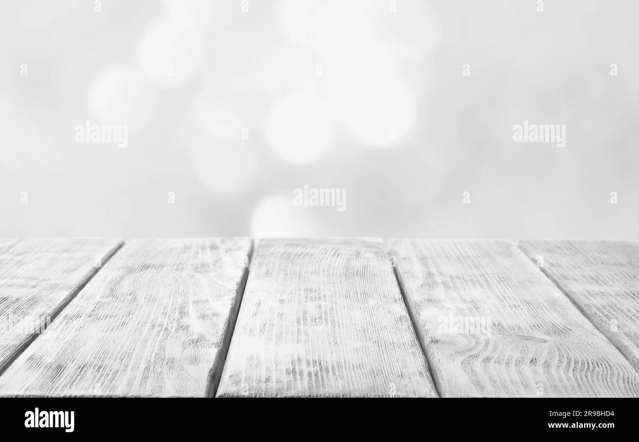 Empty white wooden surface against blurred background, bokeh effect. Space for design Stock Photo