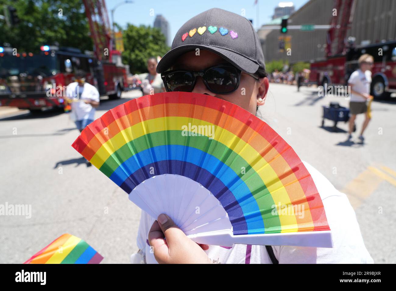 St. Louis, United States. 25th June, 2023. A woman displays a colorful