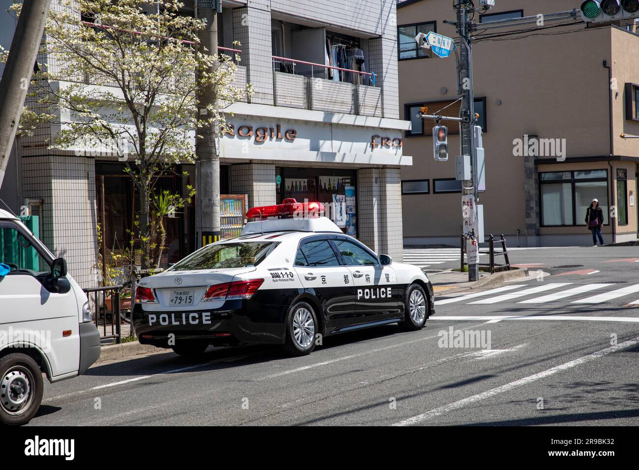 Kyoto police vehicle, japanese toyota police car driving through Kyoto city centre,Japan,Asia,2023 Stock Photo