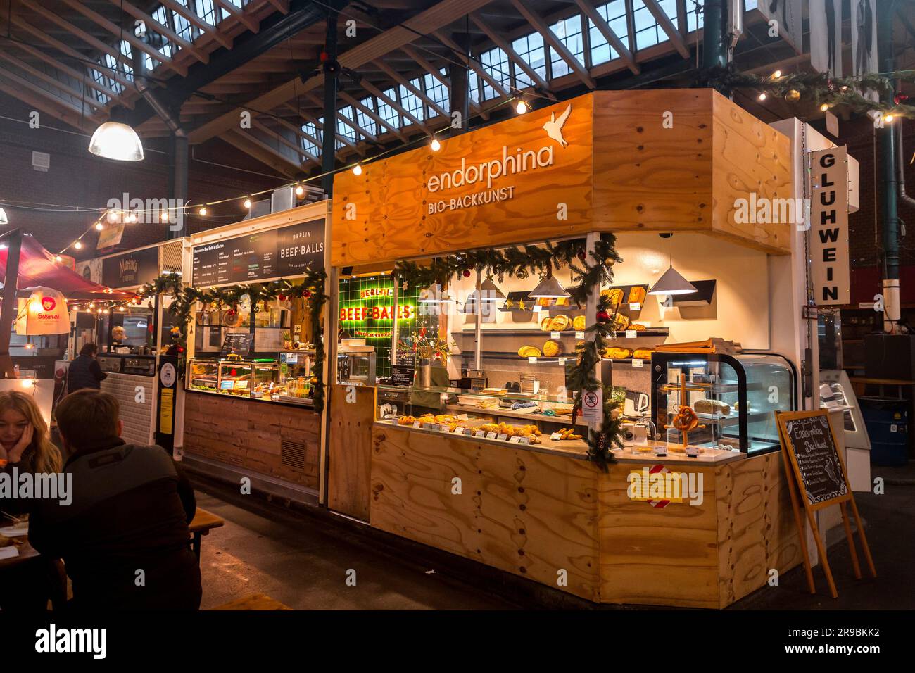Berlin, Germany - 17 DEC 2021: Markthalle Neun is an indoor market with international food vendors & shops, plus occasional community events, located Stock Photo