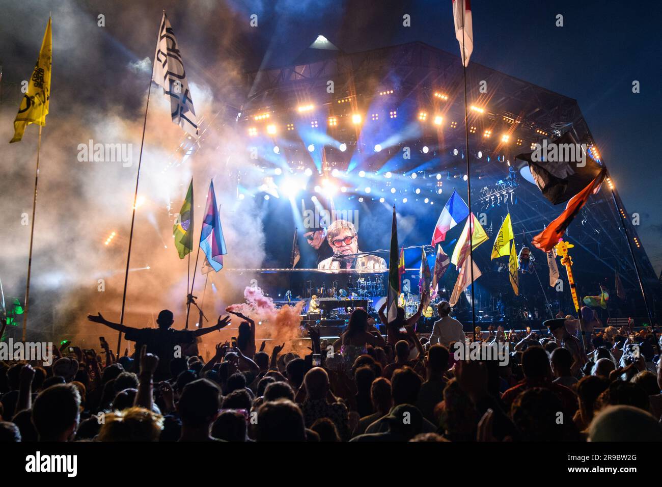 Somerset, UK. 25 June 2023. The crowd watch Elton John performing on the Pyramid Stage, at the Glastonbury Festival at Worthy Farm in Somerset. Picture date: Sunday June 25, 2023. Photo credit should read: Matt Crossick/Empics/Alamy Live News Stock Photo