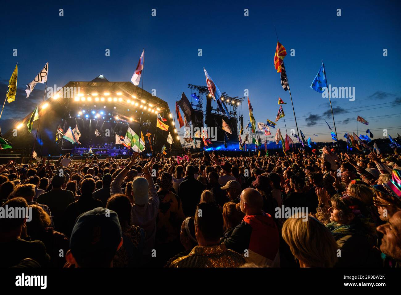 Somerset, UK. 25 June 2023. The crowd watch Elton John performing on ...