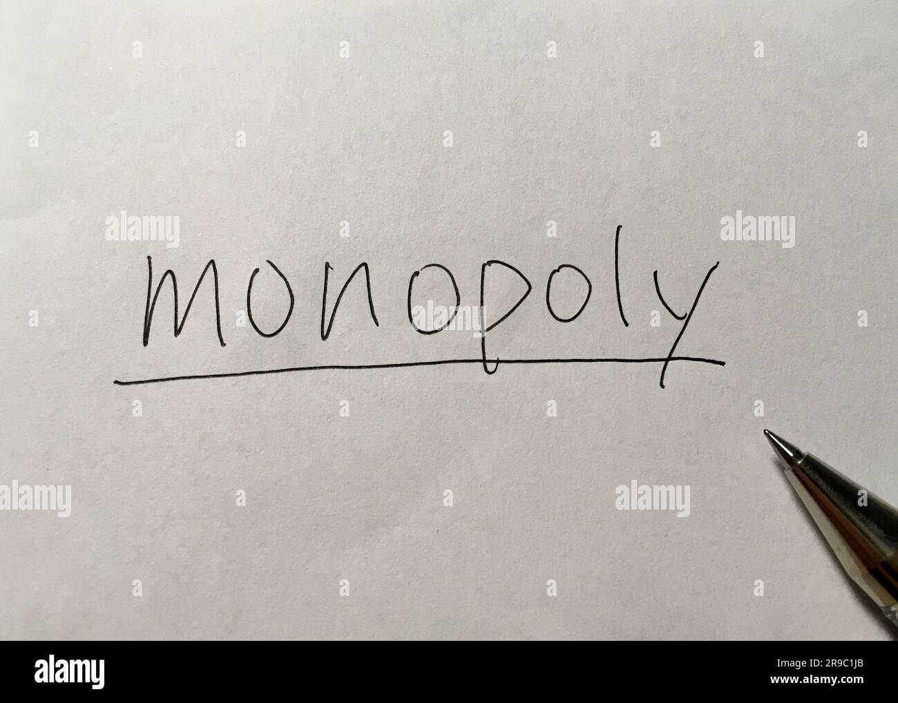 Monopoly concept word on paper background Stock Photo