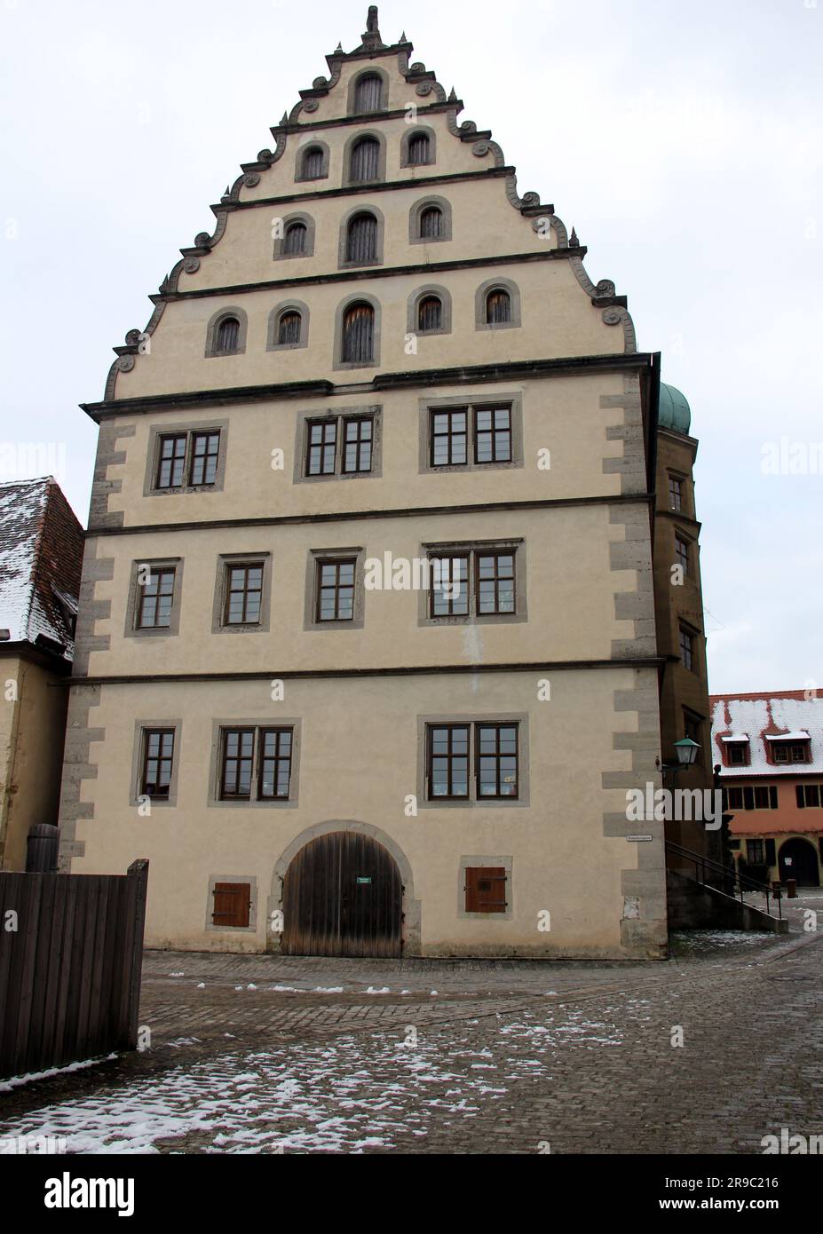 Renaissance building of the Old Gymnasium,built in 1589, side elevation with the stepped gable of the roof, Rothenburg ob der Tauber, Germany Stock Photo