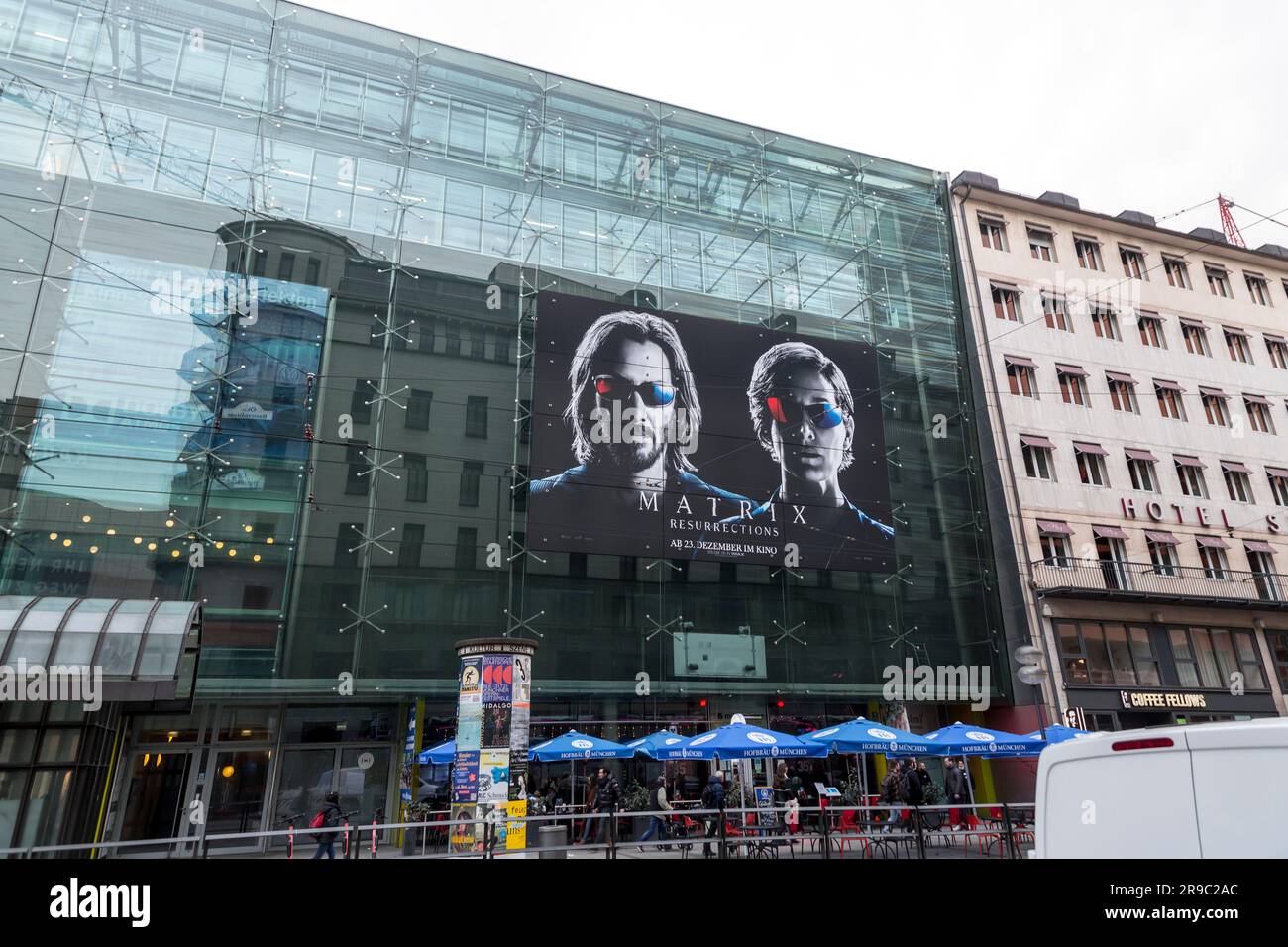 Munich, Germany - DEC 23, 2021: Large advertisement of the movie Matrix, Resurrections on the wall of a building on Bayerstrasse, Munich, Germany. Stock Photo