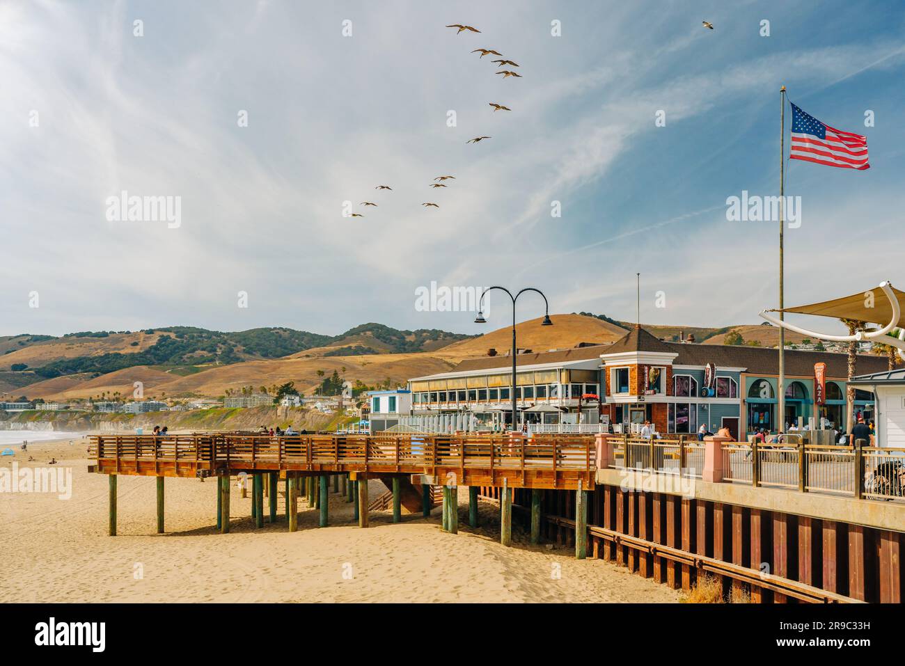 Pismo Beach, California, USA - June 3, 2022. Wooden boardwalk along the