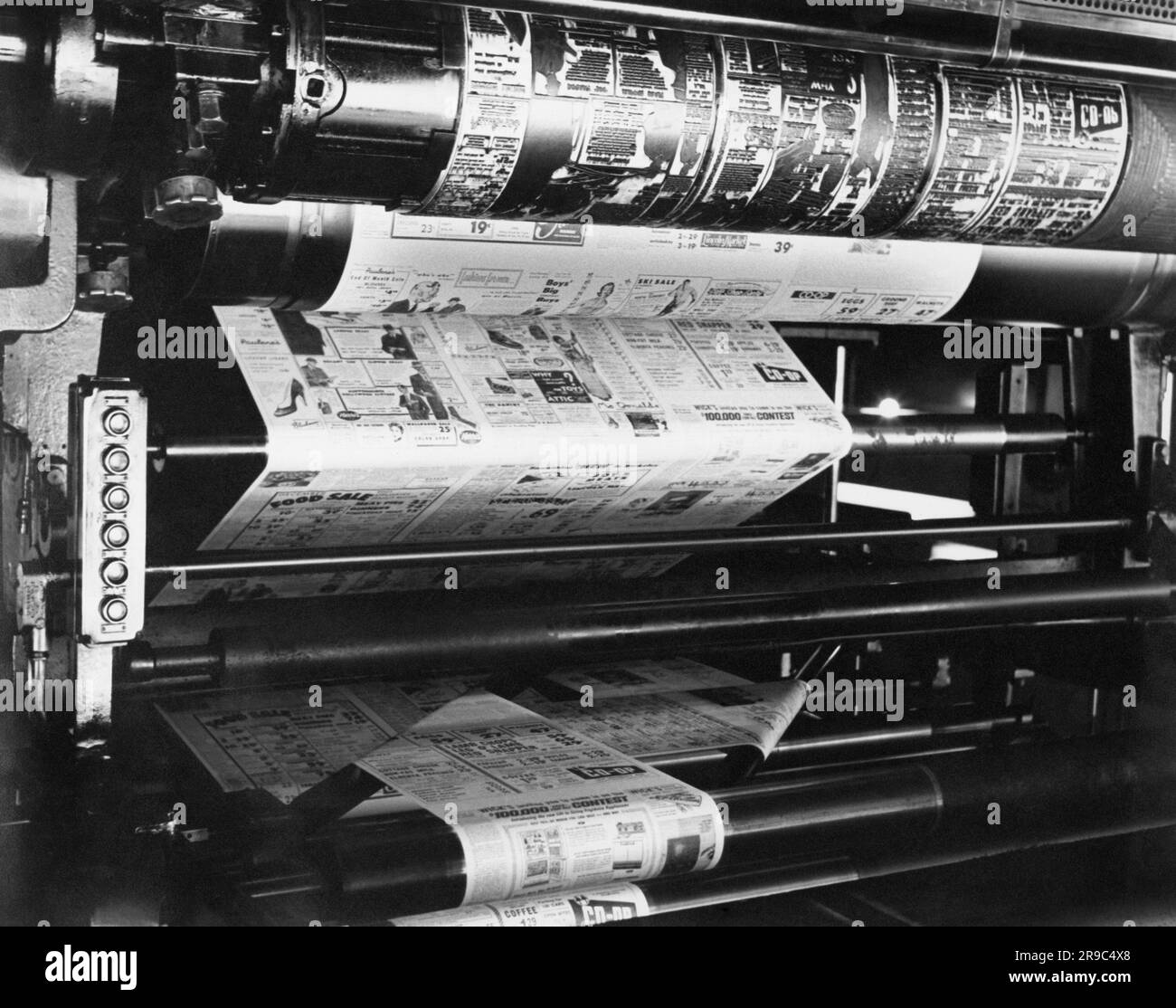 California c. 1938 A newspaper being printed on a press. At the top