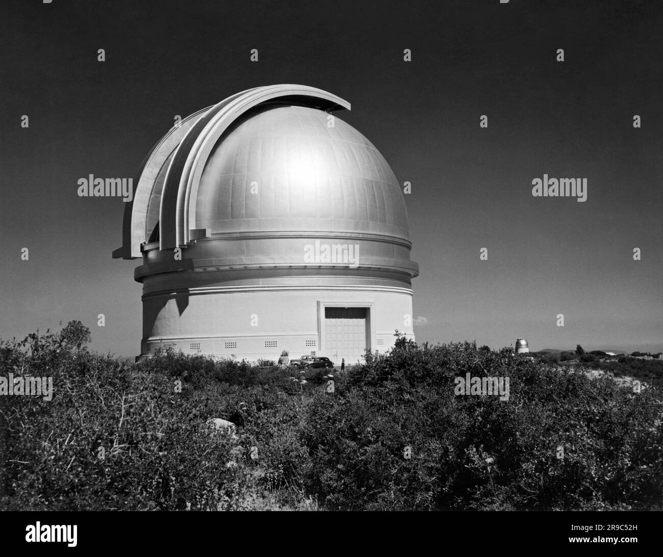 Palomar Mountain, California:  1941 Cal Tech's Mount Palomar Observatory in San Diego County. The smaller observatory at the right houses the 18' refracting telescope. Stock Photo