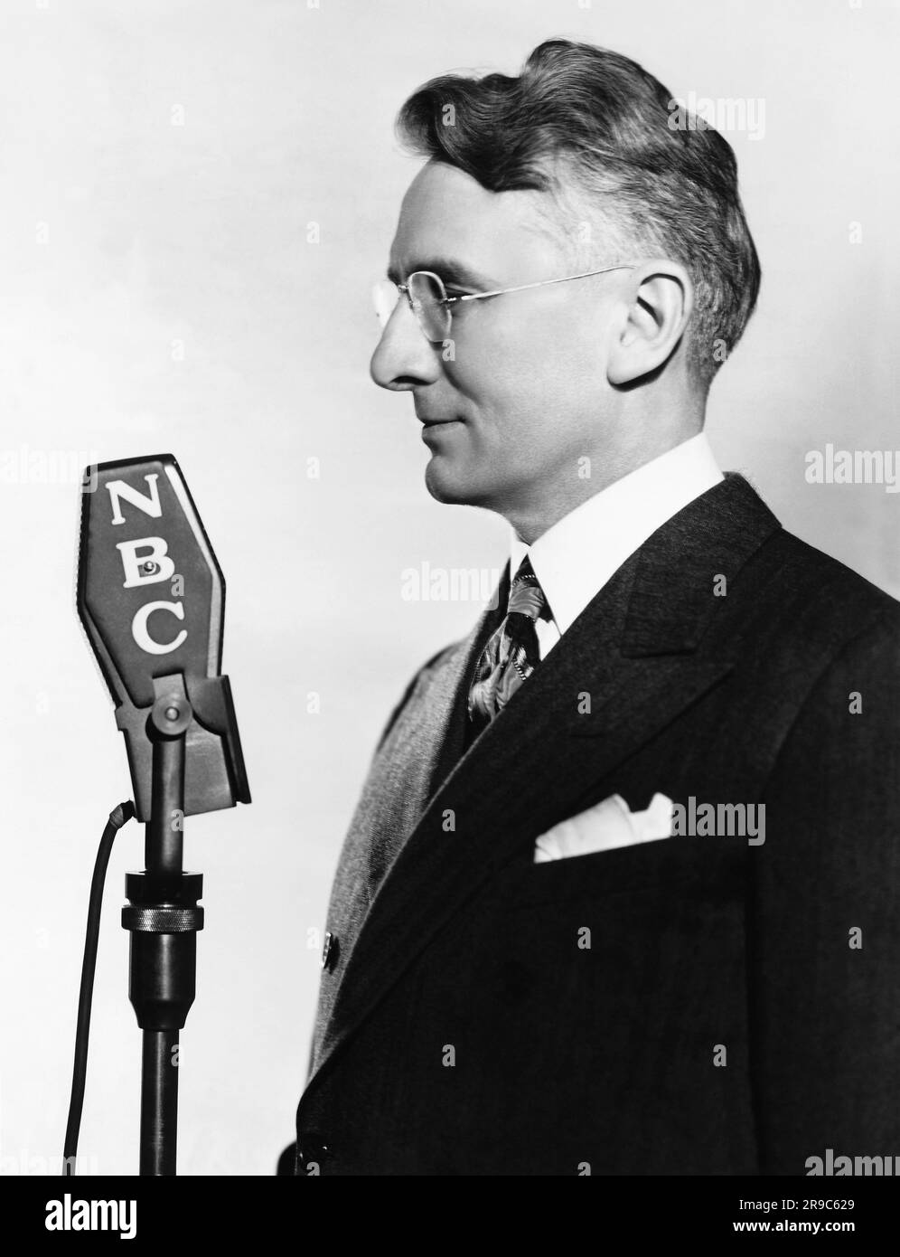 United States:   January 25, 1938 Photograph of Dale Carnegie doing his NBC show, 'How to Win Friends and and Influence People'. Stock Photo