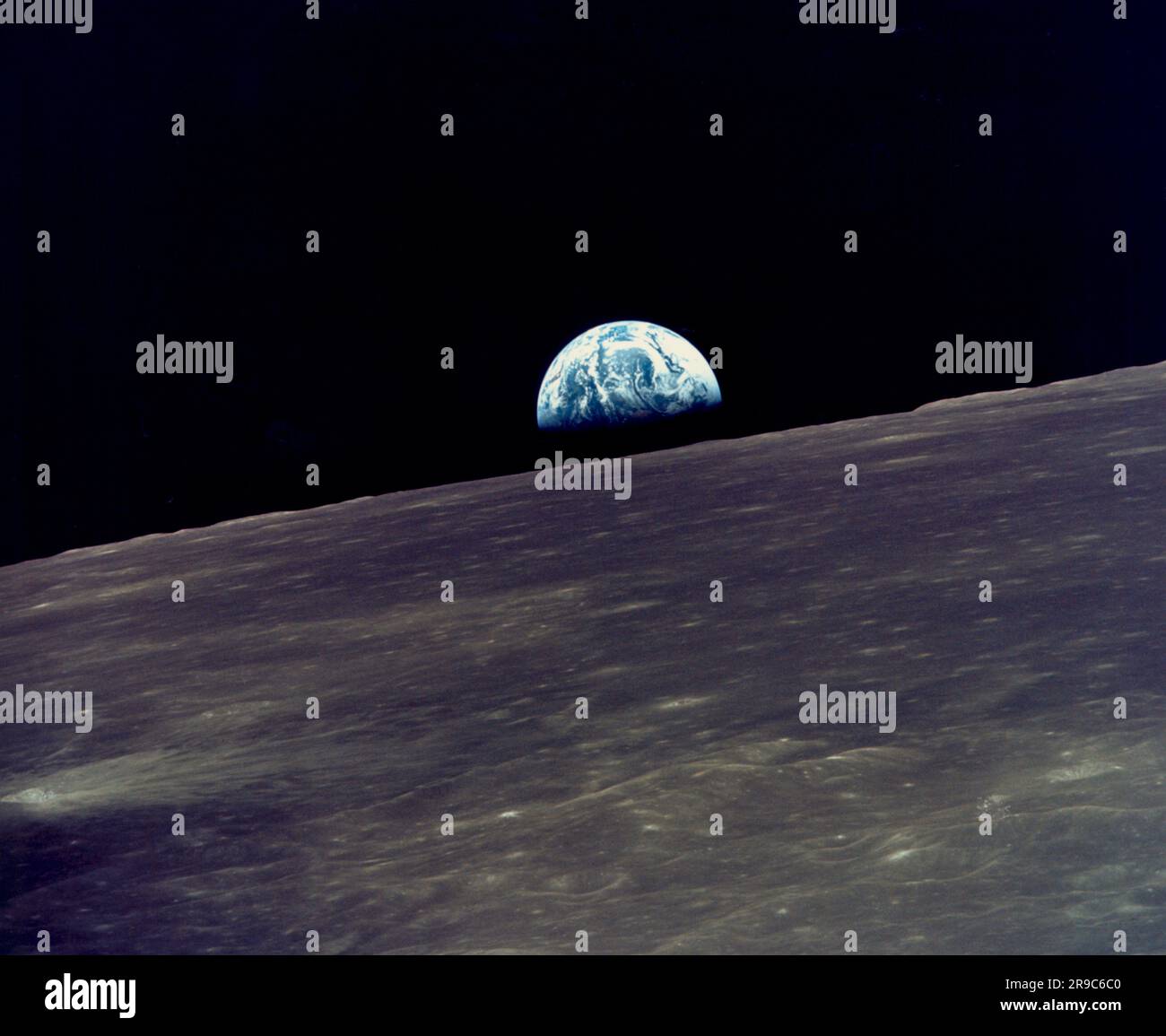 Moon:  May, 1969 View of the earth rising above the lunar horizon photographed from the Apollo 10 Lunar Module, (Snoopy) as it orbited around the moon. Stock Photo