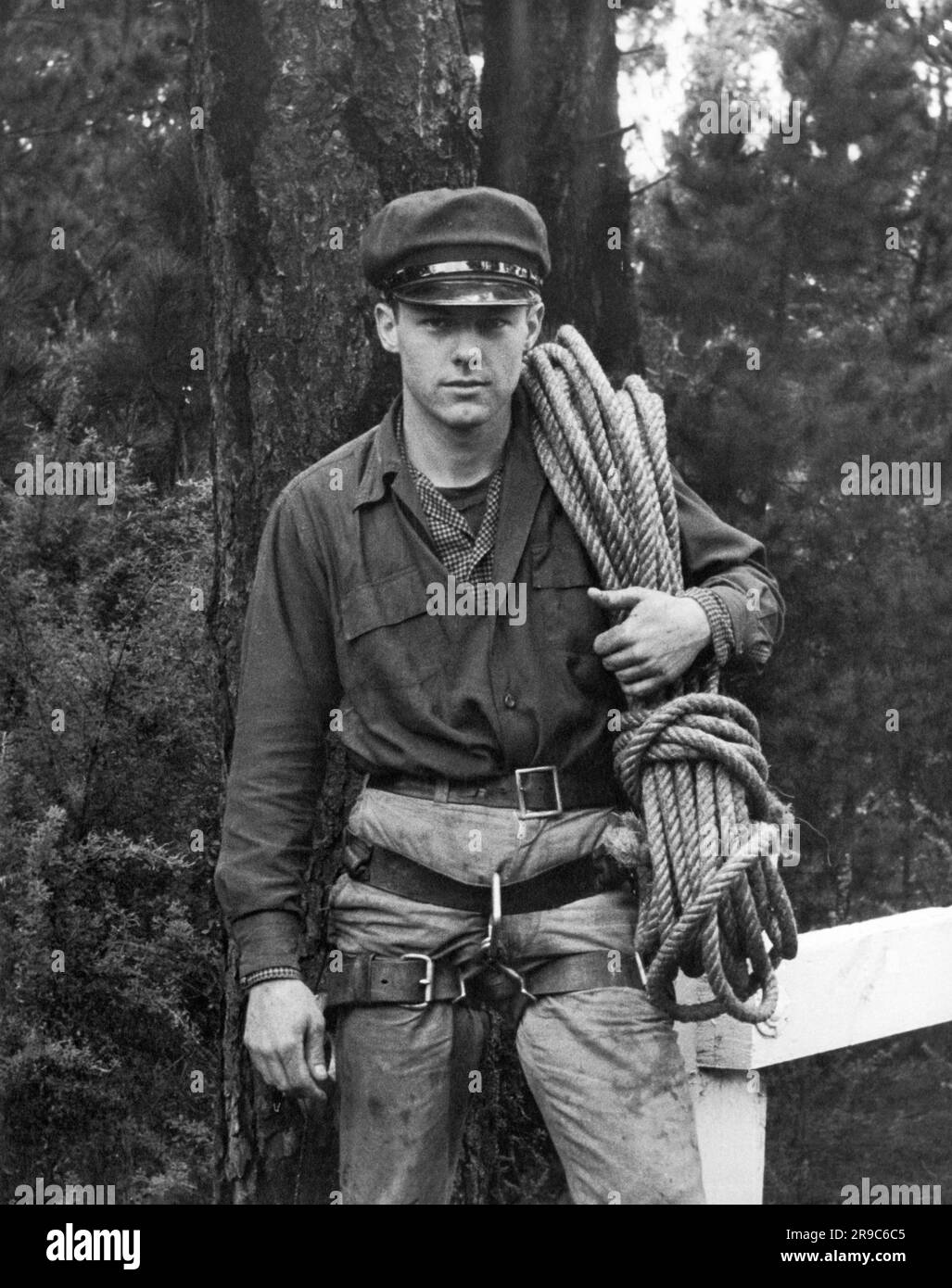 United States c. 1950 A young man in climbing gear with a rope over his shoulder Stock Photo