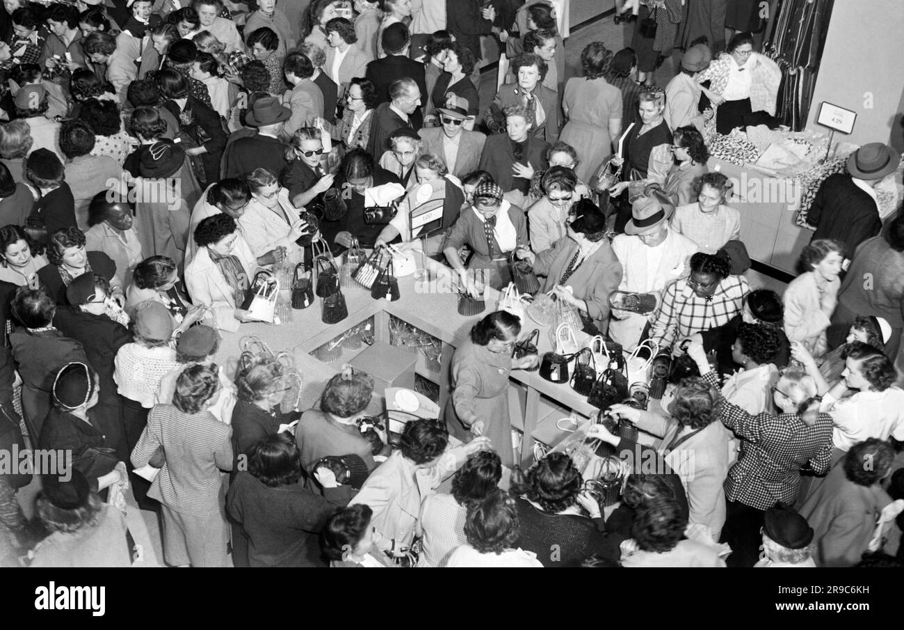 Los Angeles, California: c. 1951 Women shoppers crowd a shopping sale ...