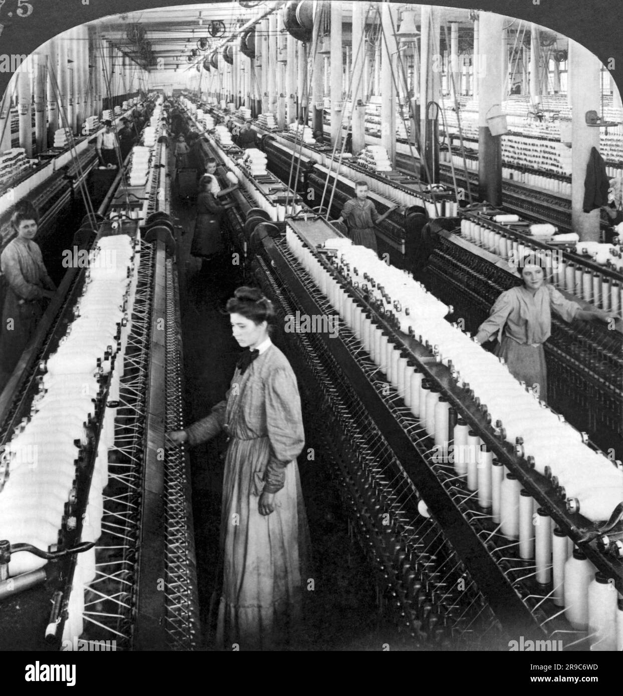 Greensboro, North Carolina:  1903 Women and girls working in the spinning room with 60,000 spindles in the White Oak Cotton Mill. Stock Photo