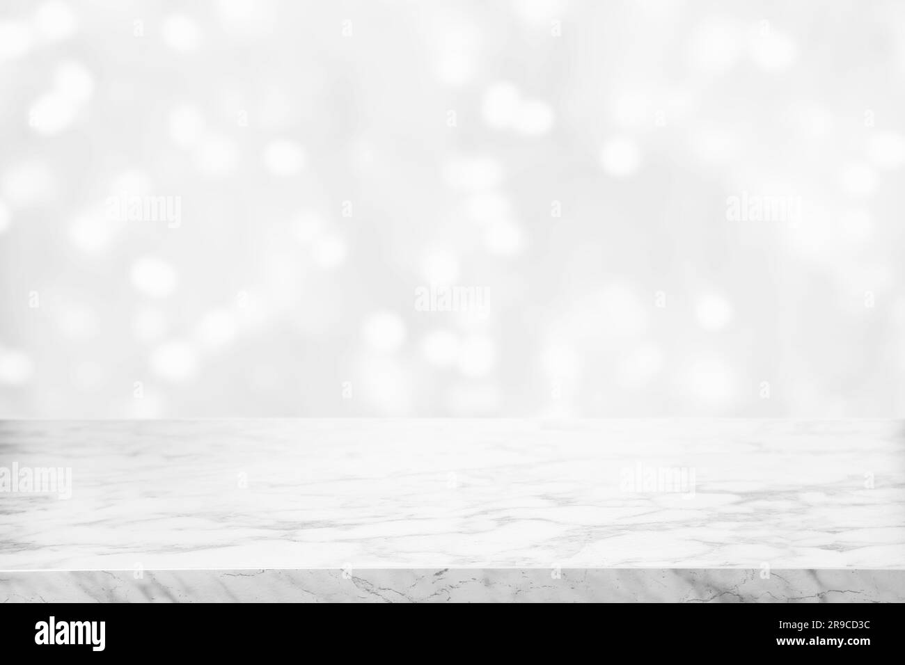 Empty white marble surface against blurred background, bokeh effect. Space for design Stock Photo