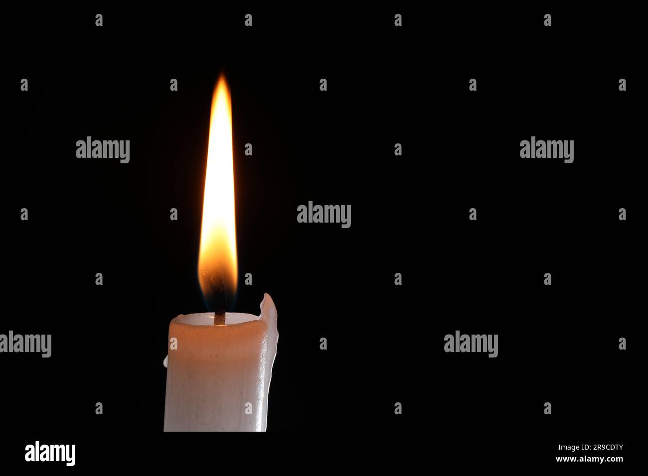 Burning candle on black background, closeup. Space for text Stock Photo ...
