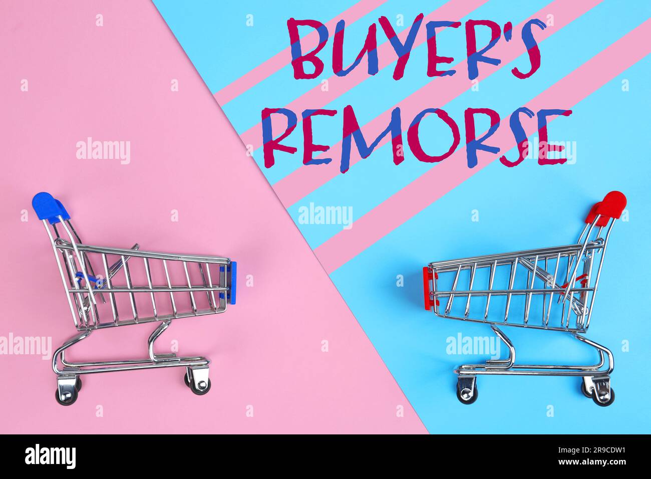 Text Buyer's Remorse and shopping carts on pink and light blue background, top view Stock Photo