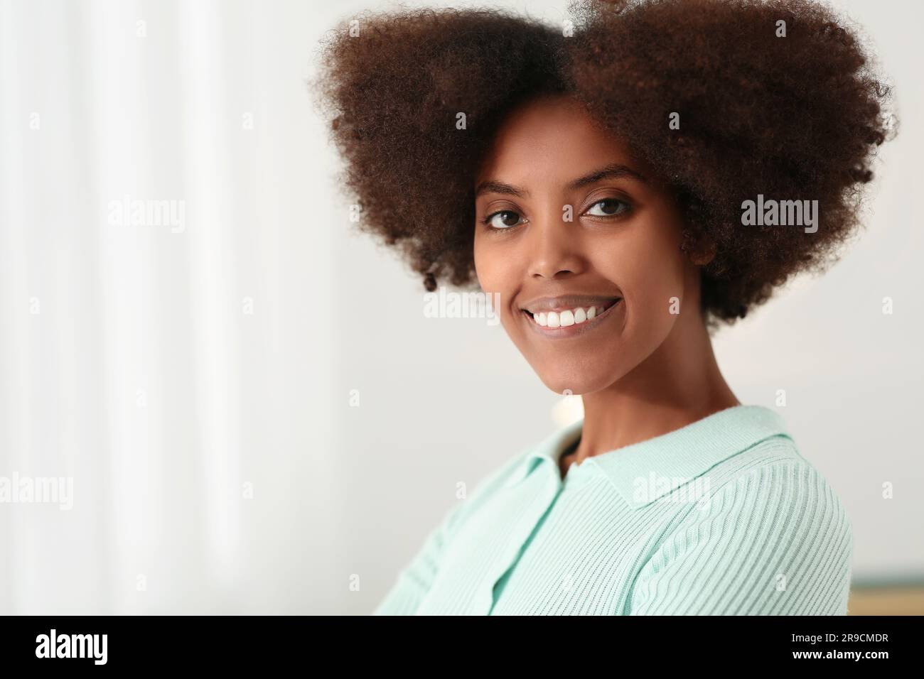 Vertical full length portrait of curvy African American woman