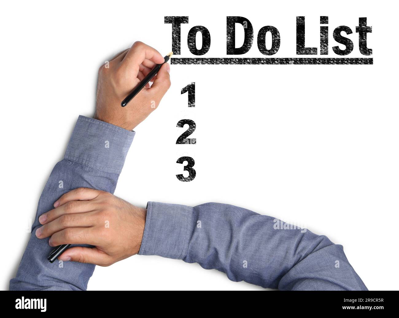 Man writing words To Do List with pen on white paper, top view Stock Photo