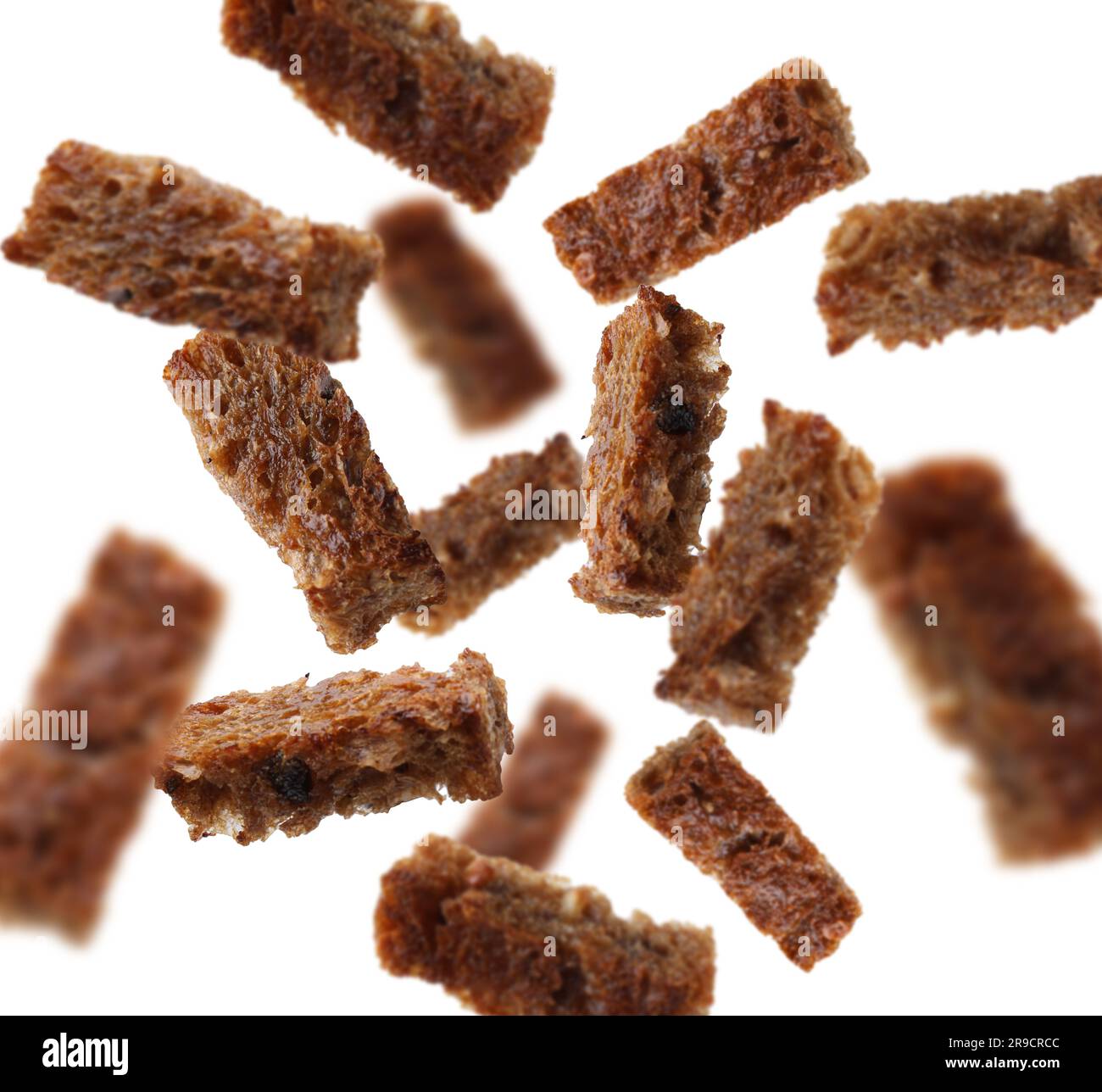 Tasty rye croutons falling on white background, collage design Stock Photo
