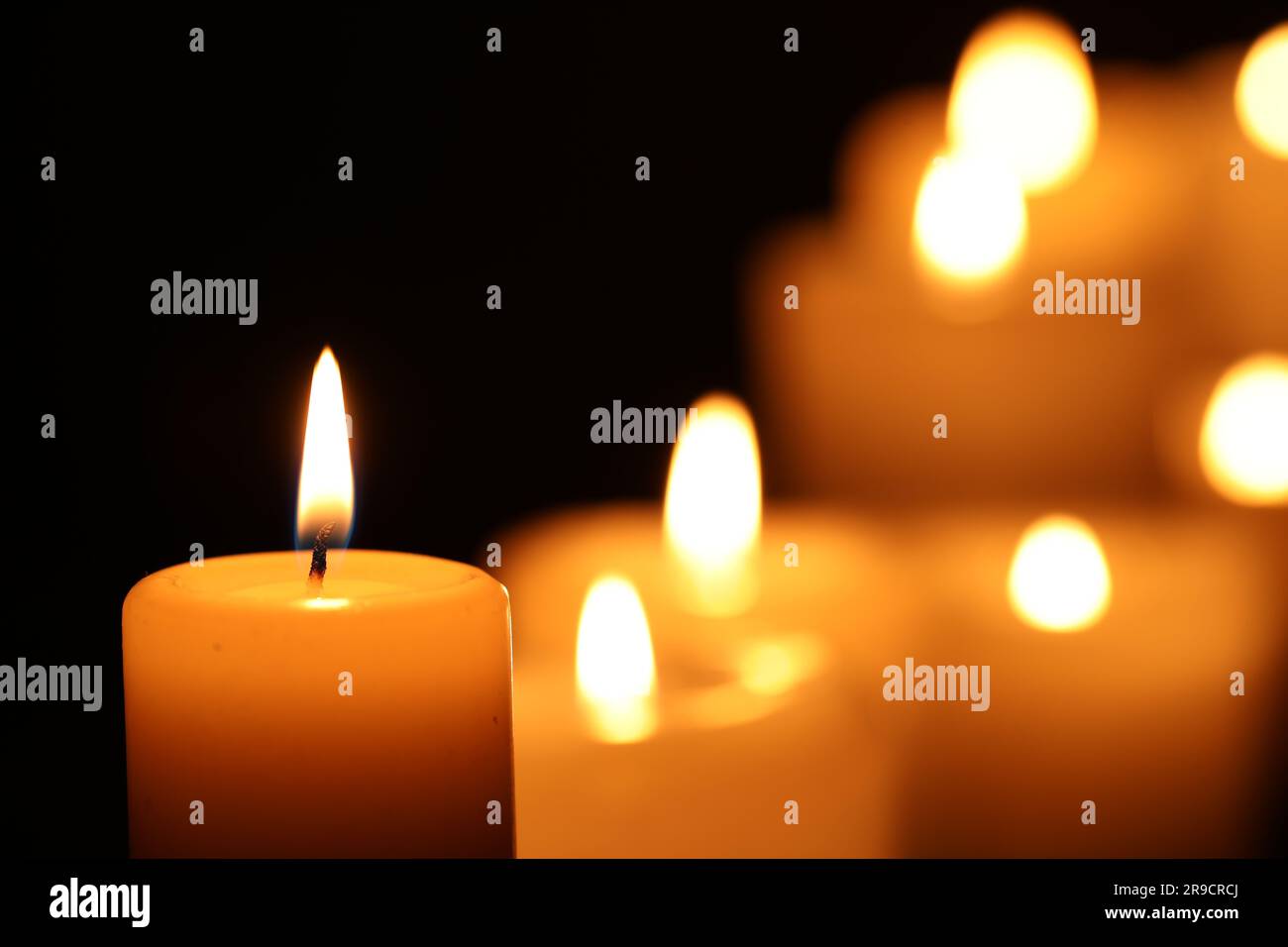 Burning candle on black background, closeup. Space for text Stock Photo ...