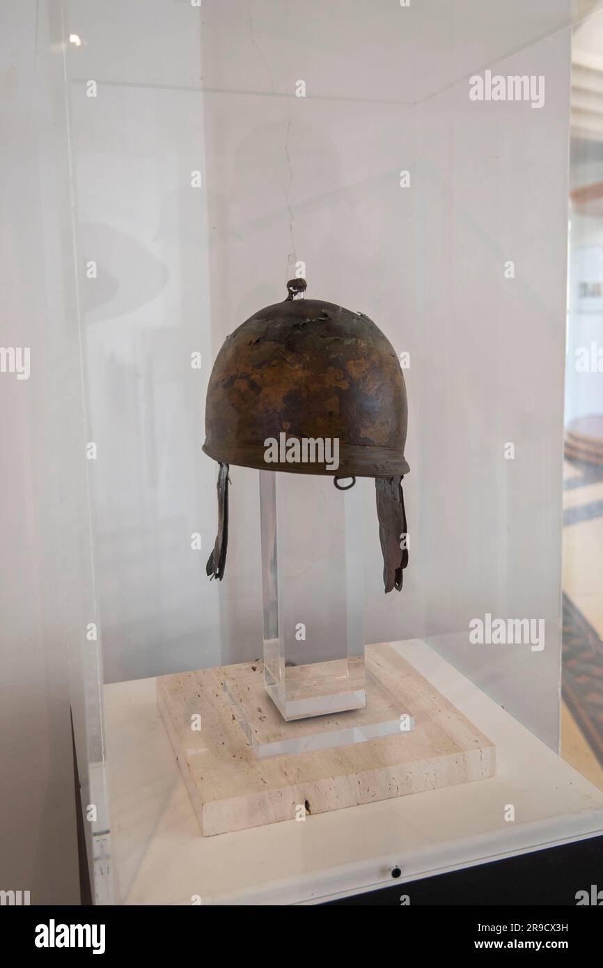 Bronze Etruscan Helmet on Display Stock Photo