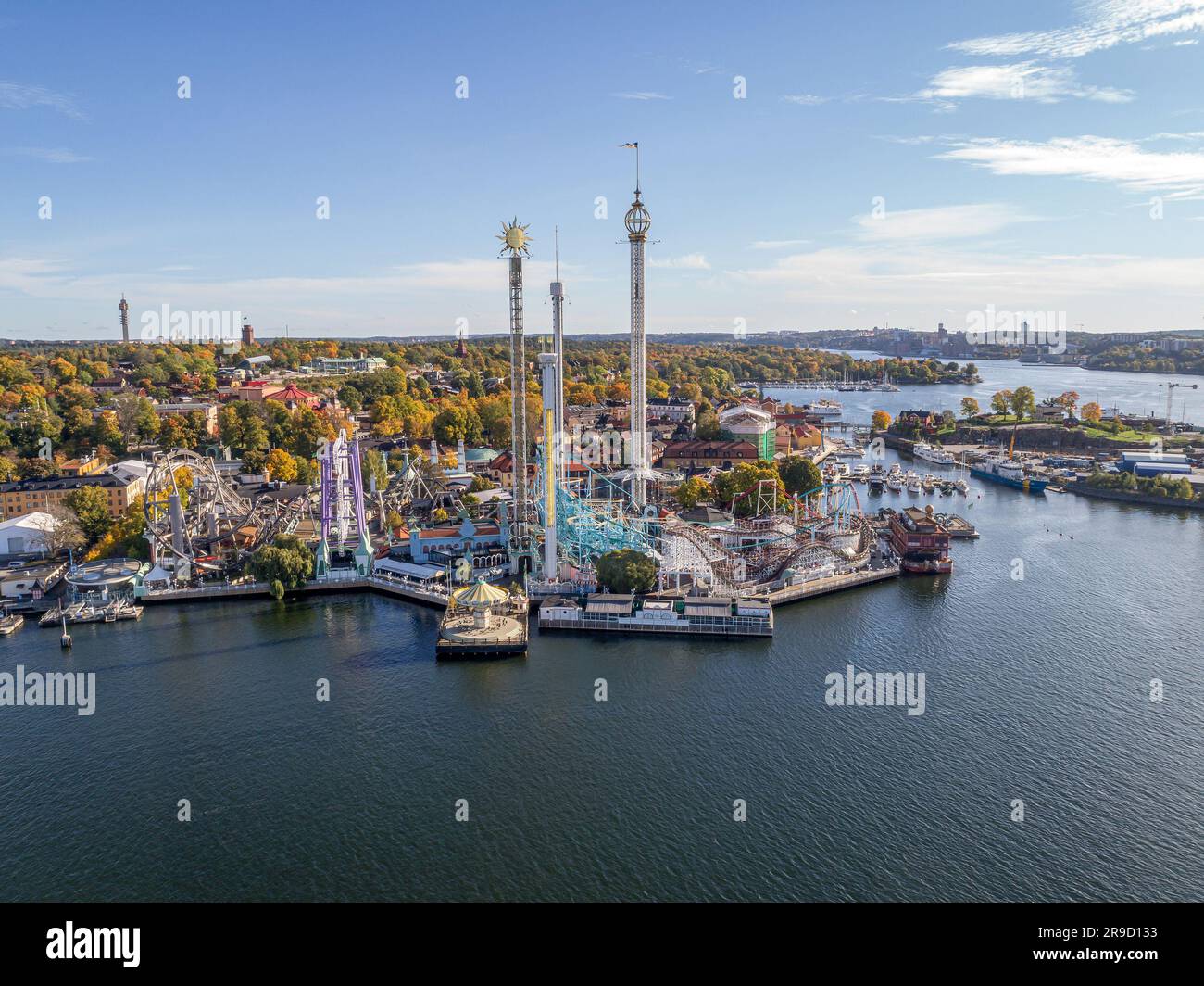 View of amusement park Grona Lund with carousels and tour rides on Djurgarden island Stockholm