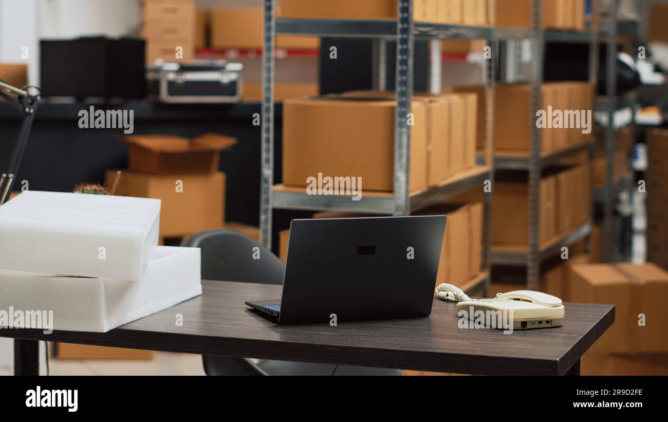 Empty warehouse depot with logistics desk and racks, storage room ...