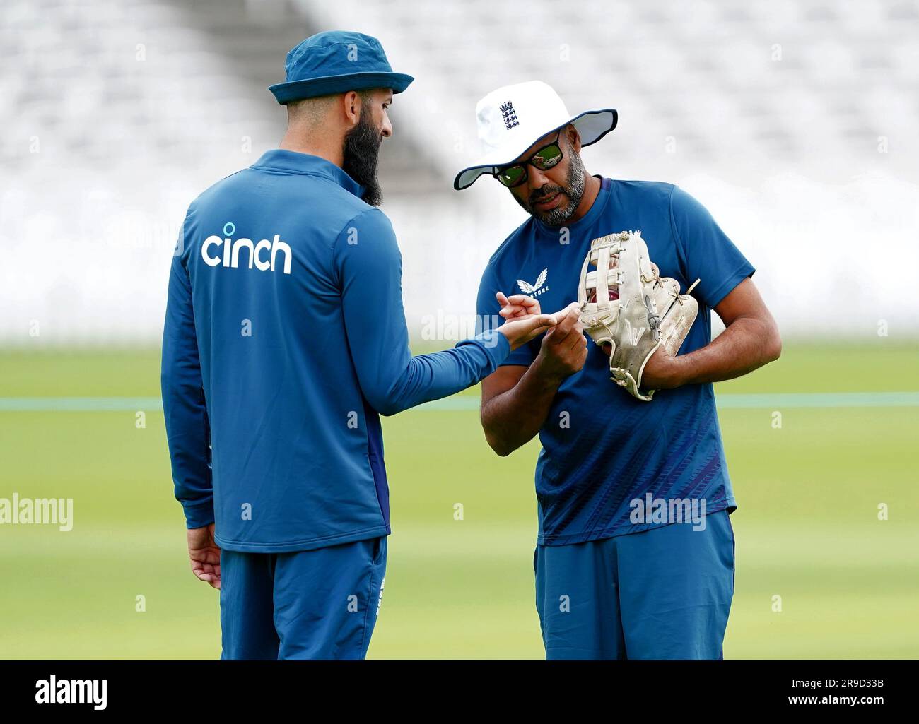 England's Moeen Ali shows his finger to spin coach Jeetan Patel during a nets session at Lord's Cricket Ground, London. Picture date: Monday June 26, 2023. Stock Photo