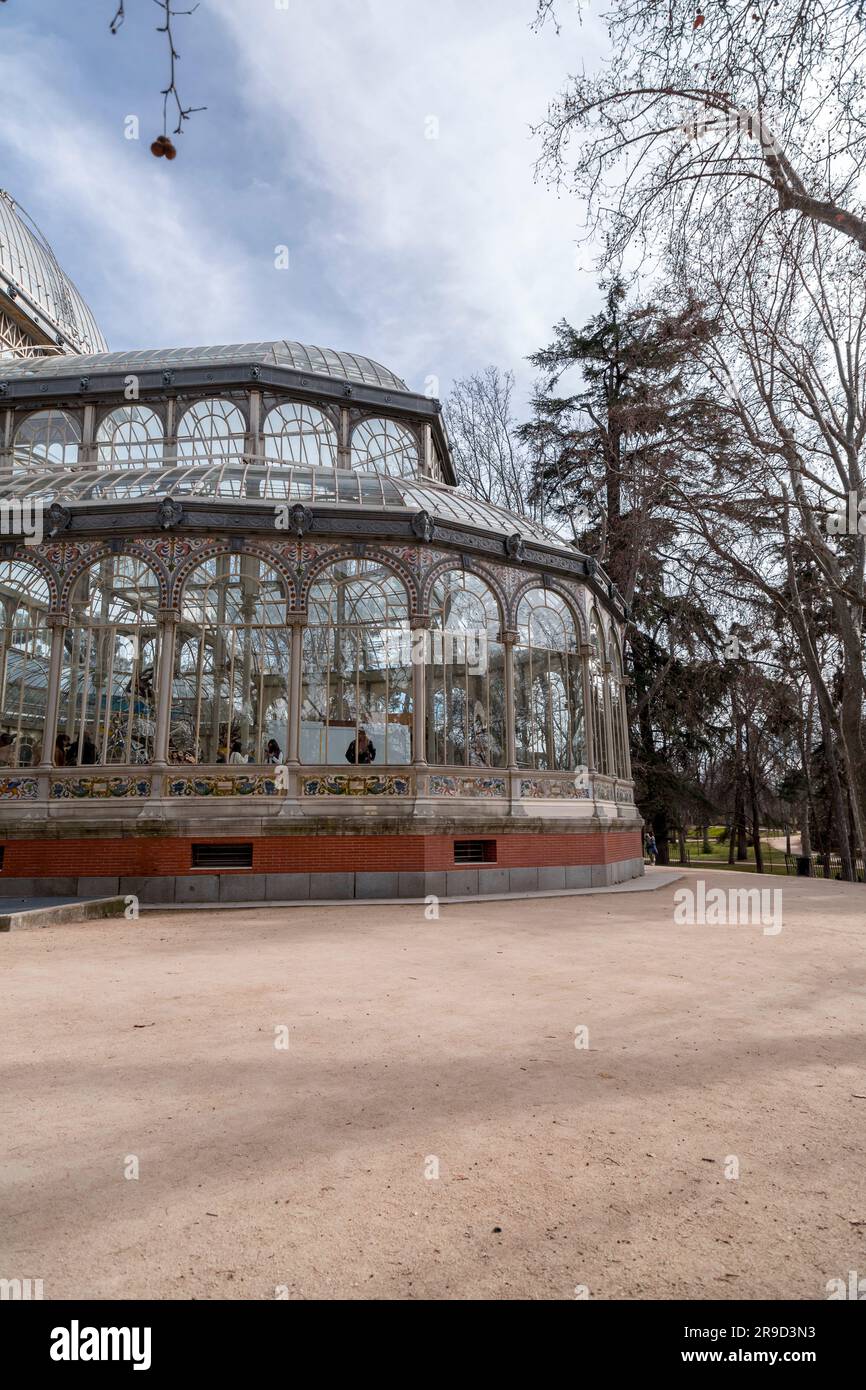 Madrid, Spain - FEB 16, 2022: El Palacio de Cristal, The Glass Palace is a conservatory located in Madrid's Buen Retiro Park. Originally designed as a Stock Photo