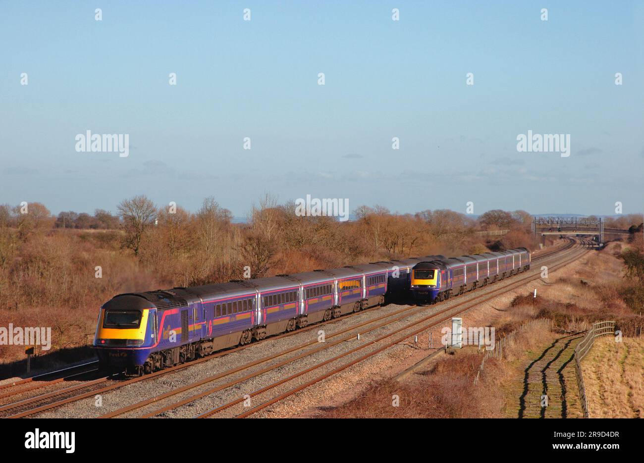 Two First Great Western HST’s passing each other on the Great Western Mainline at Denchworth. 9th February 2006. Stock Photo