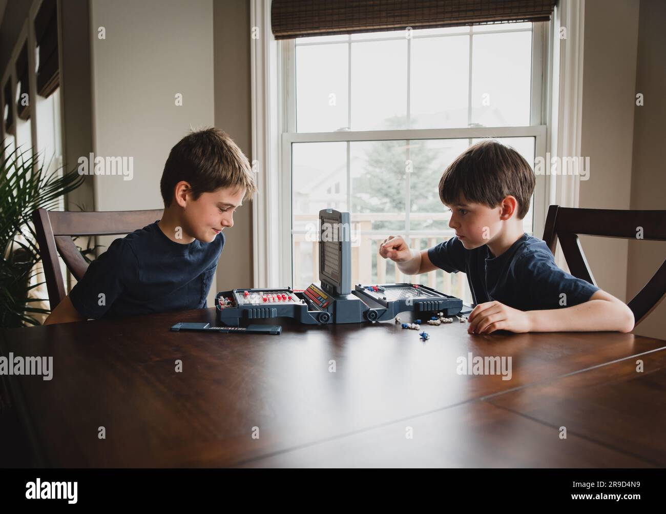 Two boys play board game hi-res stock photography and images - Alamy