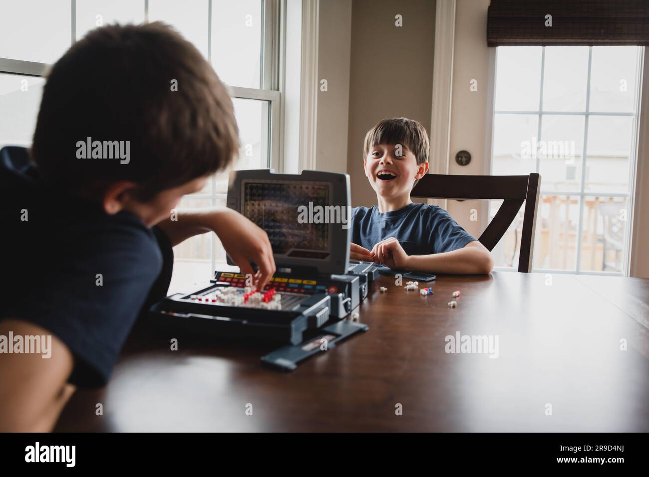 Two boys play board game hi-res stock photography and images - Alamy