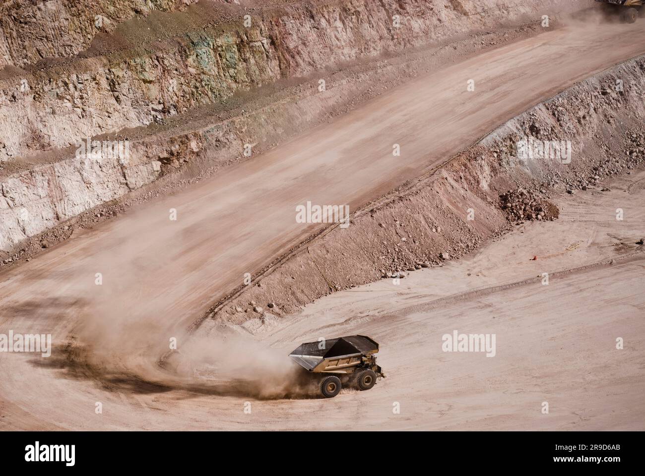 Empty haul truck at bottom of open-pit mine Stock Photo