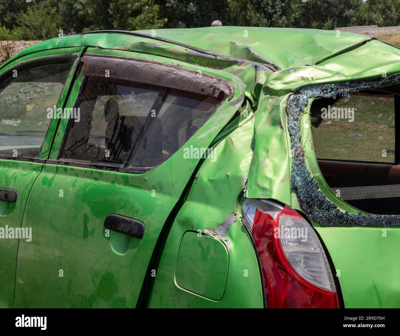 Rollover horrific traffic accident severely damaged the car. Stock Photo