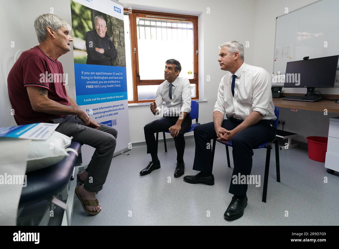 Prime Minister Rishi Sunak with Health Secretary Steve Barclay speaking to patient Terrence (no surname given) during a visit to Rivergreen Medical Centre in Nottingham. Picture date: Monday June 26, 2023. Stock Photo