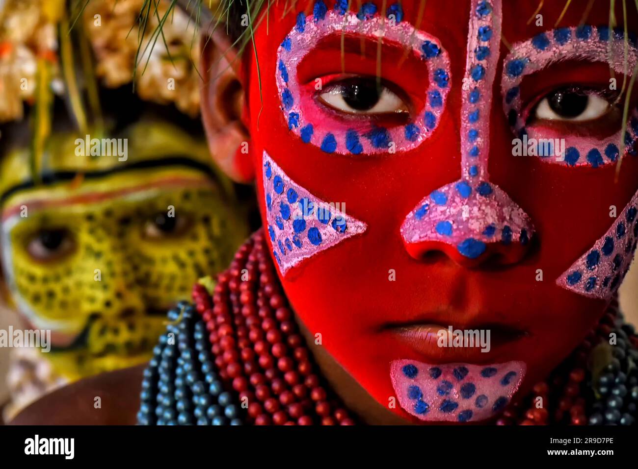 Young Children Pose With Their Faces Painted As Part Of Their young-children-pose-with-their-faces-painted-as-part-of-their