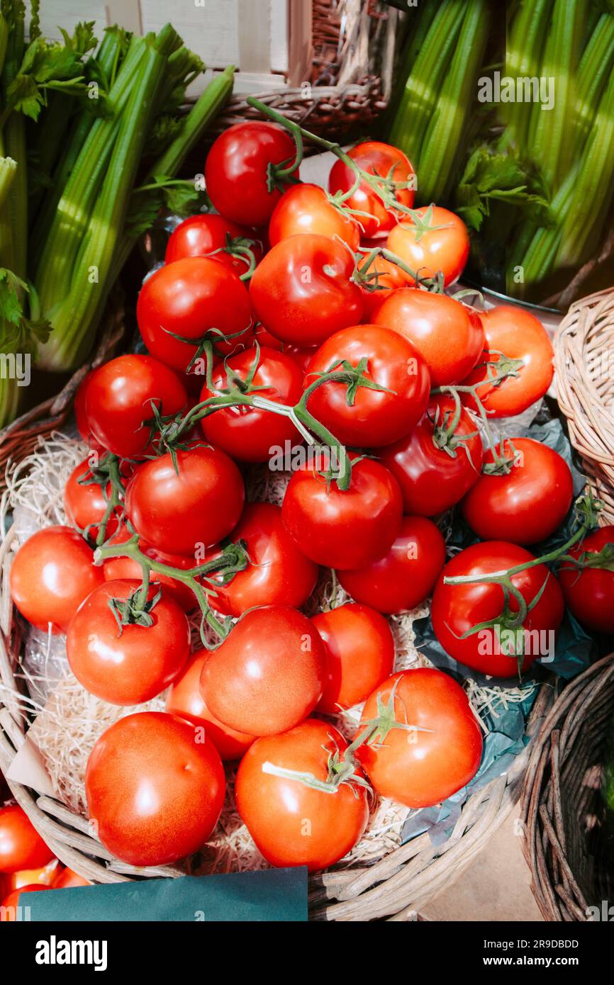 Tomatoes sold at an open green market Stock Photo - Alamy