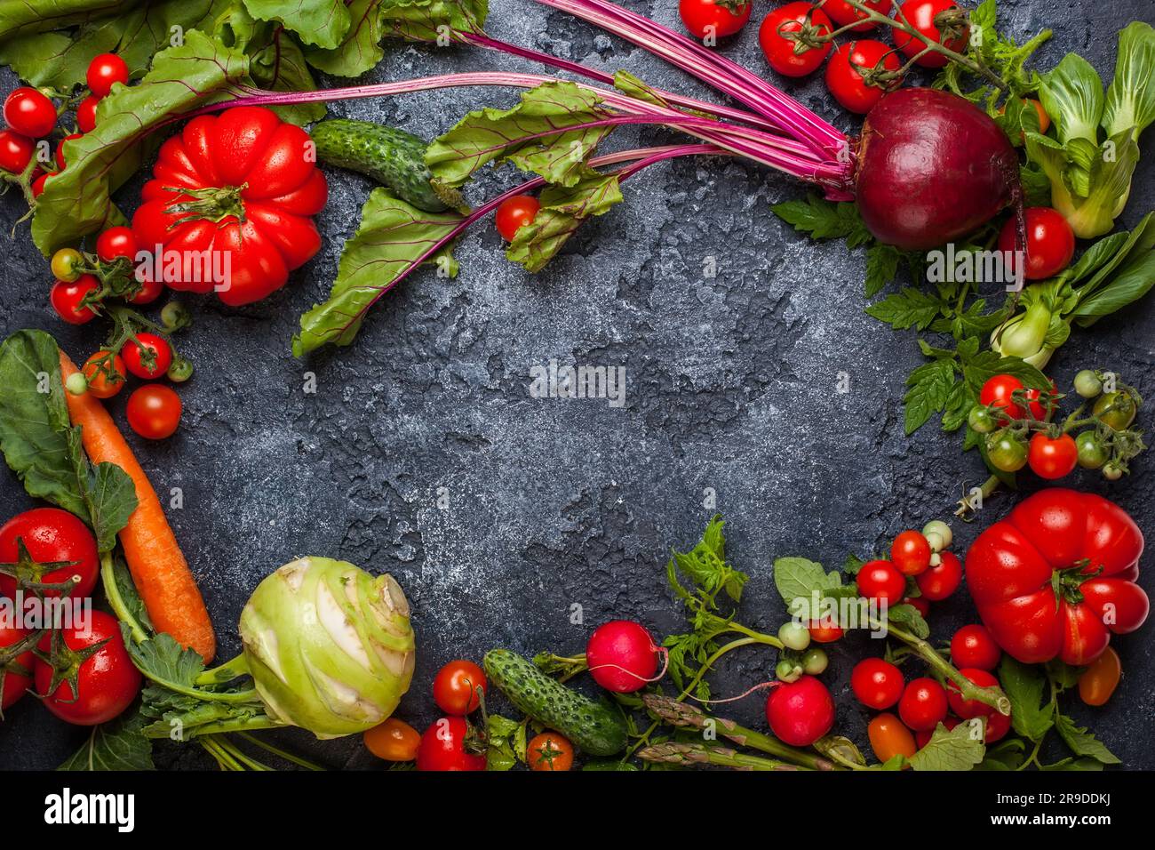 Fresh different vegetables  on  a black background. Top view Stock Photo