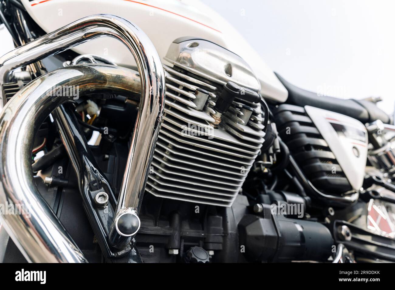 The engine of a classic motorcycle. side view. motor, cylinders, cooling fins Stock Photo