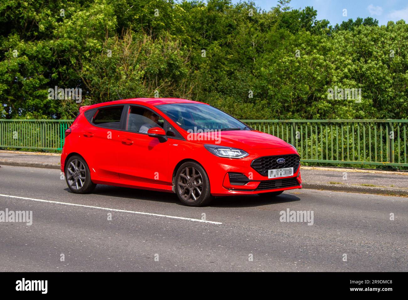 2023 Red Ford Fiesta StLine Turbo, 1.5litre, threecylinder EcoBoost unit crossing motorway